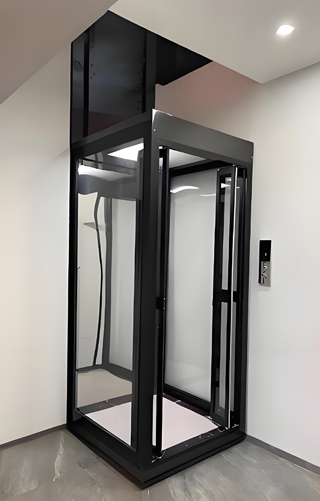 ablack frame home elevator lift on the corner of a house